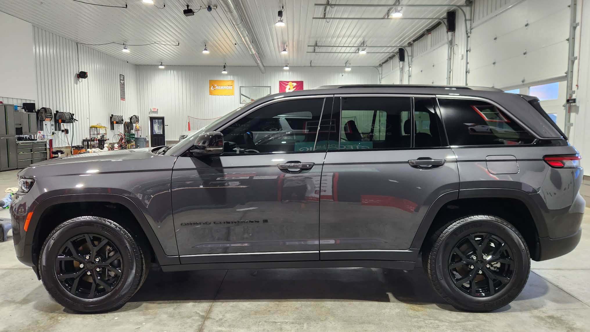 Jeep Grand Cherokee with tinted glass — automotive and architectural film